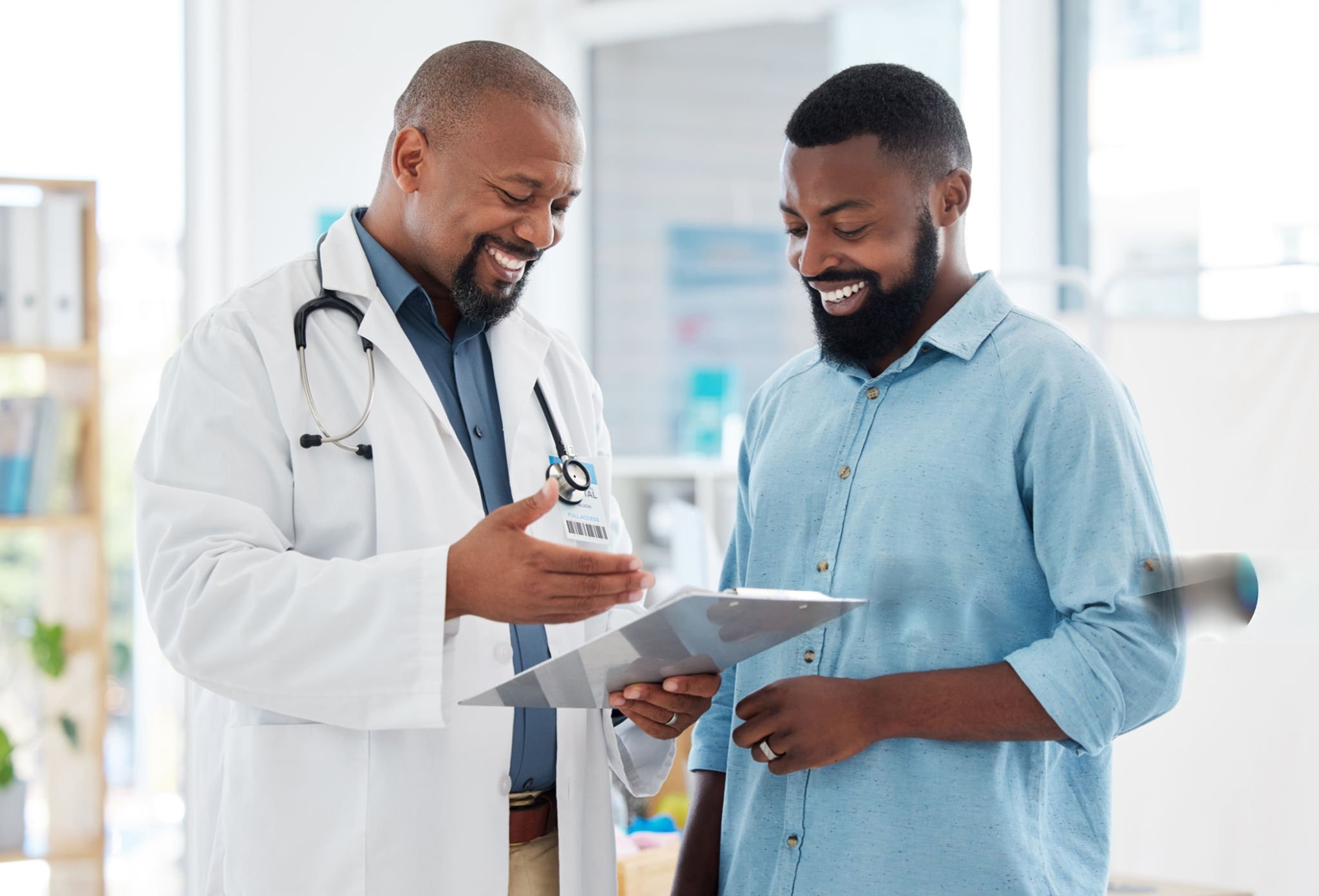 Doctor checking a patient's blood pressure during a consultation in Lagos, Nigeria