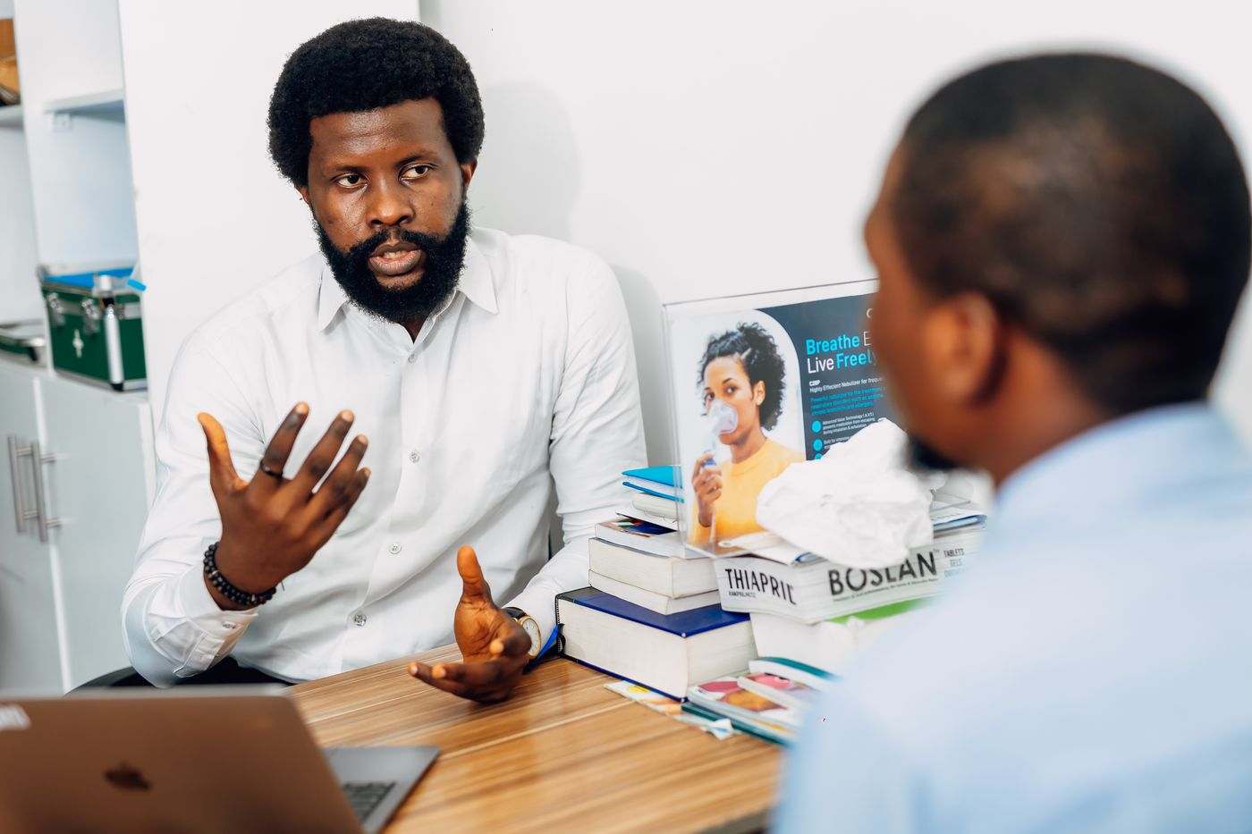 Doctor listening to a patient during a consultation