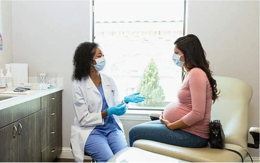A doctor attending to a pregnant womman